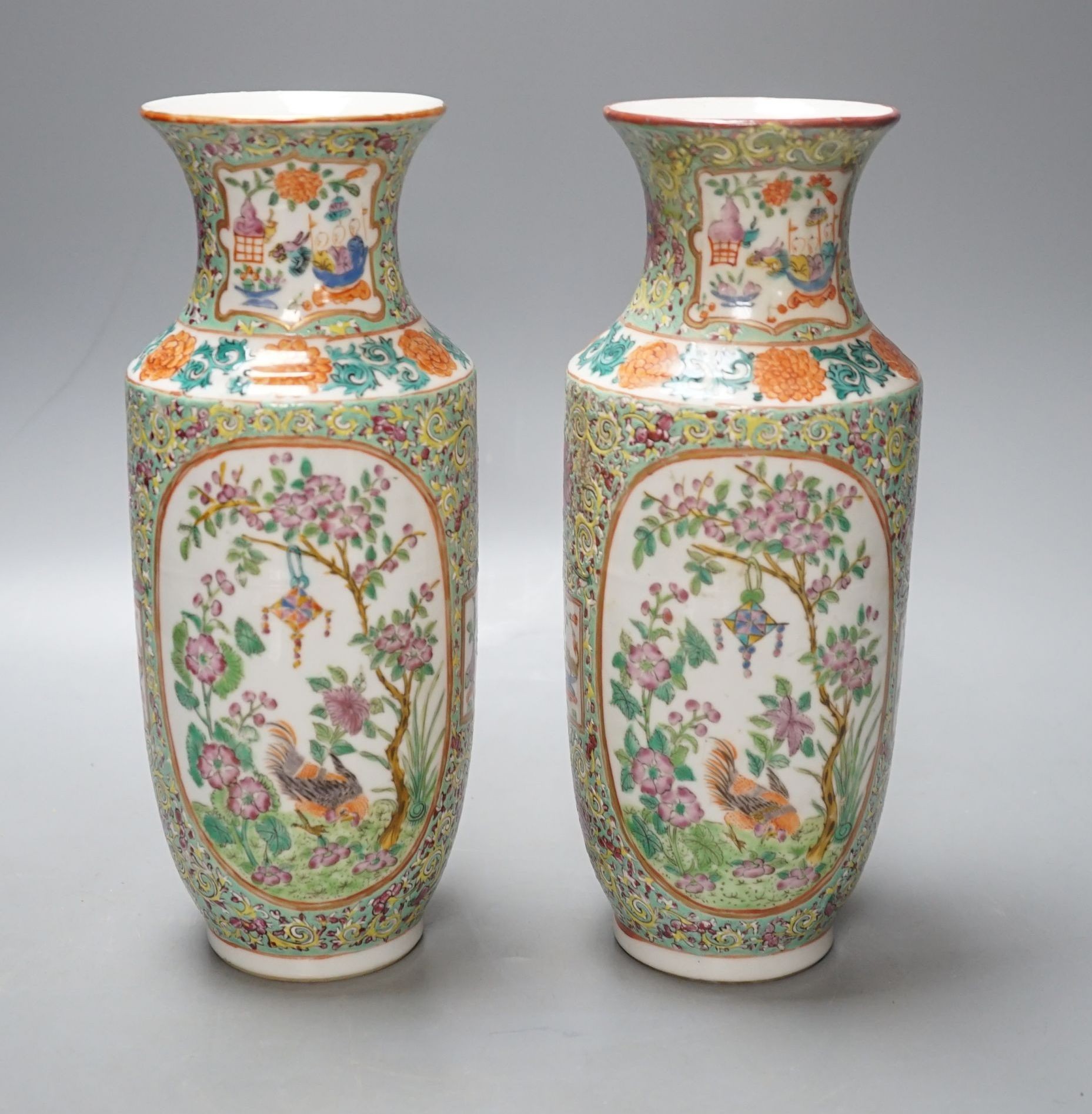A pair of 19th century Chinese Canton decorated famille rose vases - 25cm tall